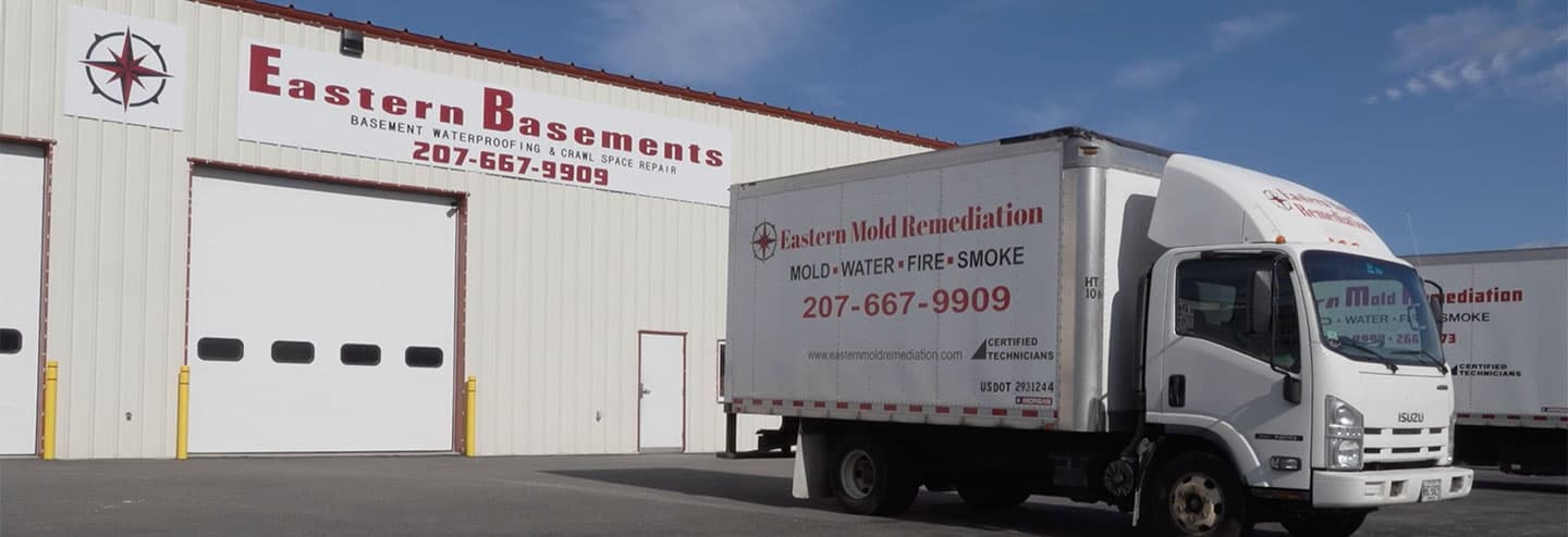 Photo of the outside of the Eastern Basements building with an Eastern Basements box truck - Home Page